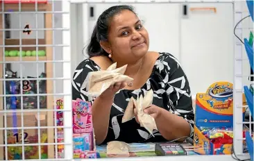  ?? DAN BROWNE/ STUFF ?? Fiza Nadeem, who owns the Kennedy Road Dairy in Napier, has had to order more stock from an Auckland supplier as her original lot from Fiji has been selling so quickly.