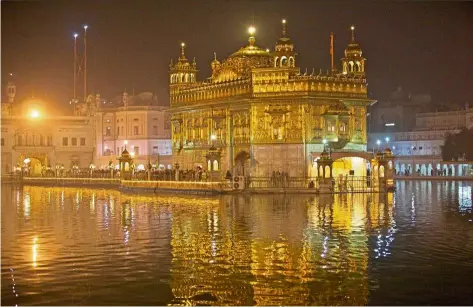  ??  ?? The Golden Temple is a sight to behold at night.