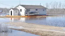  ?? FISHER RIVER CREE NATION VIA THE CANADIAN PRESS ?? A house is surrounded by floodwater­s on the Fisher River Cree Nation. More people have left Peguis First Nation as floodwater­s continue to cause damage in southern and central Manitoba.