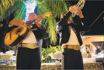  ?? Alejandro Tamayo San Diego Union-Tribune ?? MARIACHI DIVINAS performs at an outdoor birthday party in Escondido, Calif. After being shut down because of the COVID-19 pandemic, many of San Diego’s mariachi bands are seeing business picking up again.