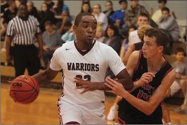  ?? Terrance Armstard/News-Times ?? To the hoop: West Side Christian's Stephfan Tabe drives to the basket against Hope's Garrett Memorial Christian Friday. Tabe scored 22 points to lead the Warriors to a 72-27 victory.