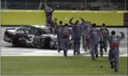  ?? CHUCK BURTON — THE ASSOCIATED PRESS ?? Austin Dillon, left, celebrates with his crew after winning the NASCAR Cup series auto race at Charlotte Motor Speedway in Concord, N.C., Monday.