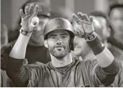  ?? Mark J. Terrill / Associated Press ?? The Diamondbac­ks’ J.D. Martinez gestures toward the camera after hitting his fourth home run.