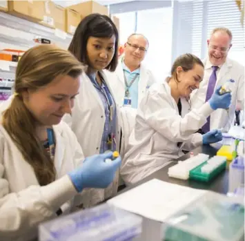  ?? ANNE-MARIE JACKSON/TORONTO STAR ?? Dr. Ronald Cohn, right, with some of his team. Cohn said he “couldn’t believe” the recovery he saw in mice.