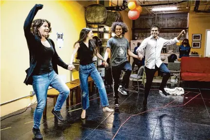  ?? Laura Morton/Special to the Chronicle dabke, ?? Actors Amal Bisharat, from left, Diala Al-Abed, Jacob Henrie-Naffaa and Lijesh Krishnan do a a folk dance, during a rehearsal for “Returning to Haifa.” The topic is heavy, so director Samer Al-Saber worked to keep the rehearsal room light.