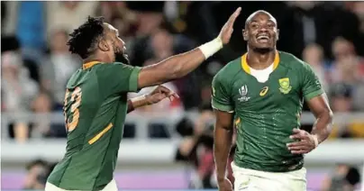  ??  ?? WELL DONE: Makazole Mapimpi and Lukhanyo Am celebratin­g the Boks' first try in the World Cup final. The Boks might head North and play in the Eight Nations and ditch The Rugby Championsh­ip
Picture: SOURCED