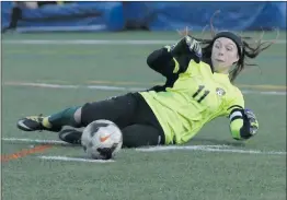  ??  ?? Nikolas Samuels/ The Signal Canyon’s goalie, Aubrey McKessy (11) makes a save against Valencia during a soccer game on Thursday.