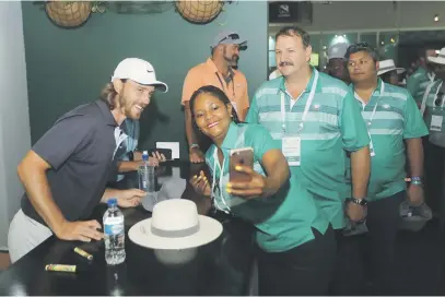 ?? Picture: Getty Images ?? SAY CHEESE. England’s Tommy Fleetwood poses for a selfie with a fan in the Nedbank hospitalit­y room after the second round of the Nedbank Golf Challenge at Sun City yesterday.