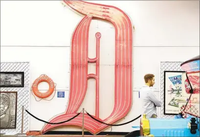  ?? Christina House Los Angeles Times ?? THE NEON “D” from the Disneyland Hotel is among the collection’s pieces on view at a Sherman Oaks pop-up exhibit.