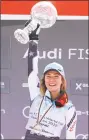  ?? Alessandro Trovati / Associated Press ?? American skier Mikaela Shiffrin celebrates with the women’s World Cup overall trophy Sunday.
