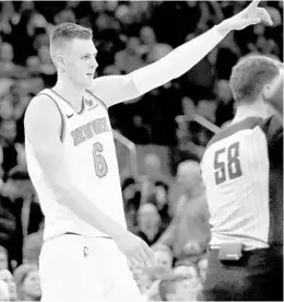  ?? ELSA/GETTY IMAGES ?? New York star big man Kristaps Porzingis, already nursing a sprained right ankle, did not attend the Knicks’ practice Saturday because he was sick, according to media reports.