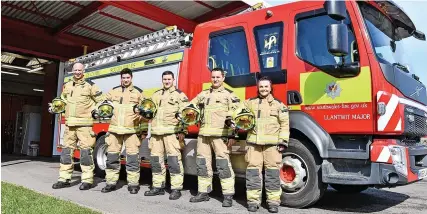  ?? GAYLE MARSH ?? Charlotte, right, at Llantwit Major fire station with colleagues, from left, Lewis Asquith, Rob Grapes, Nathan Downey and Mark Stokes