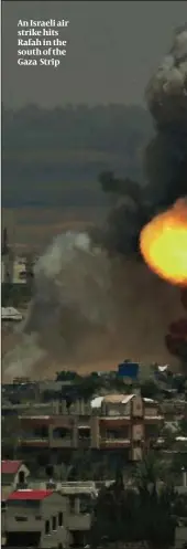  ??  ?? An Israeli air strike hits Rafah in the south of the Gaza Strip