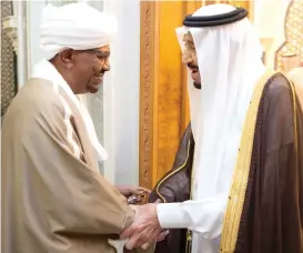  ??  ?? King Salman receives Sudanese President Omar Al-Bashir at Al-Safa Palace in Makkah on Tuesday. (SPA)