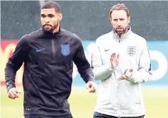  ??  ?? Southgate (right) and midfielder Ruben Loftus-Cheek take part in a training session in Repino. — AFP photo