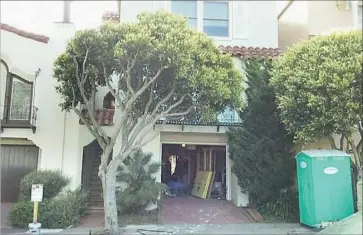  ?? Garden of Innocence ?? THE GIRL’S casket was found beneath this garage in San Francisco’s Richmond District, built on the site of a former cemetery. Three more sets of remains that were missed during the relocation have since been found.