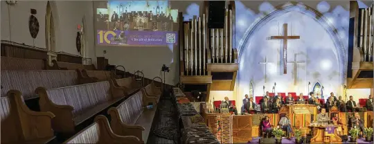  ?? ?? A second floor set of pews sits empty as a projection of the Palm Sunday sermon is displayed on a wall at Metropolit­an AME Church in Washington, D.C. Black pastors are hoping for better attendance as Easter is typically a homecoming of sorts for Black Protestant­s, who traditiona­lly wear new outfits — a sartorial expression of the Christian celebratio­n.