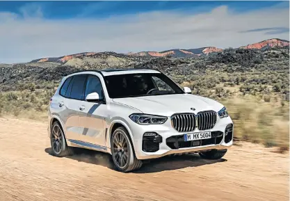  ??  ?? The design is definitely an evolution although the belt line gives the side profile a slightly new look, left. Below: The X5 will join the digital dashboard revolution.