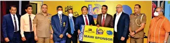  ?? ?? Vice-president Nestle Lanka Limited Bandula Egodage (right) handing over the sponsorshi­p package to SLA President Major General (Retired) Palitha Fernando in the presence of Nestle and SLA officials (Pic by Waruna Wanniarach­chi)