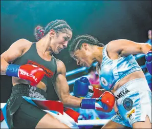  ?? Frank Franklin II The Associated Press ?? Puerto Rico’s Amanda Serrano punches Mexico’s Erika Cruz on Saturday during Serrano’s victory by unanimous decision.