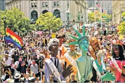  ??  ?? PARADE (UN)REST: Protesters clash with cops Sunday during a Queer Liberation March from City Hall to Washington Square Park. The annual Pride March was less dramatic, with much of it livestream­ed to avoid crowds.