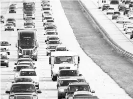  ?? ORLANDO SENTINEL FILE ?? Traffic clogs Interstate 4 in Orlando. In 2019, consumers worldwide bought 64 million new personal cars and 27 million new commercial motor vehicles, a paltry 2.1 million of which were electric-powered.