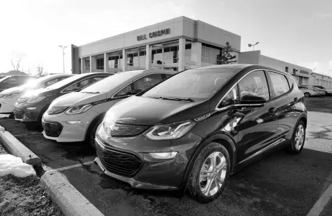  ?? AP PHOTOS ?? A 2021 Chevrolet Bolt EV is displayed with 2020 models at Bill Crispin Chevrolet Thursday, February 25, 2021, in Saline, Michigan.