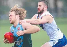  ??  ?? GRIP: Geelong Amateur’s Patrick Killen tries to break the tackle.