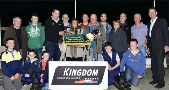  ??  ?? Sponsor Nial Murphy presents the winner’s trophy to Mary McElligott on behalf of the O`Neill-McElligott-Foley Syndicate after Cú Ui Néill won the Castleisla­nd Tyre Centre Stakes Final at the KGS on Saturday. From left are Conor, Seán and Brian Lyons,...