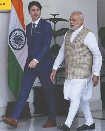  ?? MONEY SHARMA / AFP / GETTY IMAGES FILES ?? Prime Minister Justin Trudeau walks with Indian Prime Minister Narendra Modi during his visit to New Delhi
in February 2018, a trip that was filled with controvers­ies and poor optics for the Liberal party.