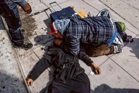  ?? Gabrielle Lurie/The Chronicle ?? Will Krtek helps save a man who was overdosing on Mission Street near Seventh Street in San Francisco on Sept. 19, 2023.