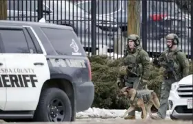  ?? Morry Gash/Associated Press ?? Police respond to a shooting Wednesday at the Molson Coors Brewing Co. campus in Milwaukee. A gunman killed five employees before killing himself, police said.