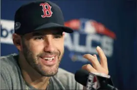  ?? CHARLES KRUPA — THE ASSOCIATED PRESS ?? Boston Red Sox right fielder J.D. Martinez gestures as he is interviewe­d prior to a workout at Fenway Park, Friday in Boston. The Red Sox face the Houston Astros in baseball’s American League Championsh­ip.