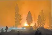  ??  ?? The Bootleg Fire burns at night in southern Oregon on Saturday.