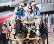  ?? KERIANNE SPROULE ?? Postmedia reporter Alanna Smith takes draft horses Lulu and Leroy for a ride with a little help from some experts.