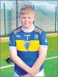  ?? ?? Fr Sheehy’s Harry Byrne played for the Tipperary primary schools team at half-time in the Munster senior football fixture against Waterford in Dungarvan on Saturday evening.