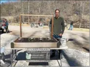  ?? SUBMITTED PHOTO ?? Chris Mattingly exhibits the work of his company, Backyard Eats, at the recent Holistic Health Fair at Valley Green Inn. Backyard Eats installs and maintains clients’ home vegetable gardens.