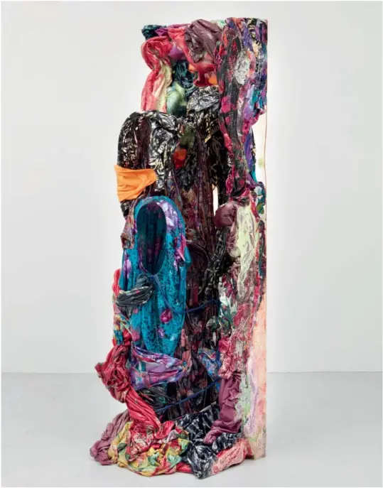 ??  ?? Kevin Beasley, Aurora, 2018; housedress­es, kaftans, t-shirts, du-rags, resin; 182.88 x 50.8 x 45.72 cm. Photo: Jason Wyche. Courtesy: the artist and Casey Kaplan, New York.