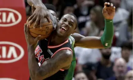  ?? AP Photo ?? STOPPER. Miami Heat’s Dion Waiters fights for the ball with Boston Celtics’ Jaylen Brown during the first half of an NBA basketball game in Miami.