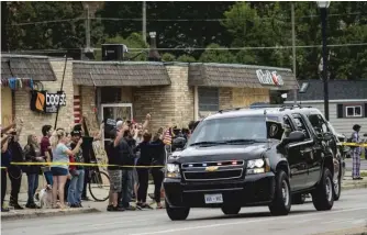  ?? ASHLEE REZIN GARCIA/SUN-TIMES ?? President Donald Trump’s motorcade travels through Kenosha on Tuesday.