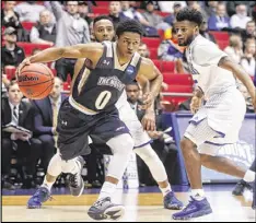  ?? JOHN MINCHILLO / AP ?? Junior Robinson, the smallest player in Division I at 5-foot-5, led Mount St. Mary’s with 23 points in Tuesday’s First Four victory over New Orleans.