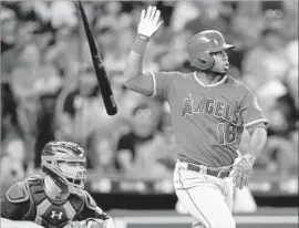  ?? Bob Levey Getty Images ?? LUIS VALBUENA gives the Angels offense a boost with a single in the fifth inning. Every Angels batter reached base at least once against the Astros.