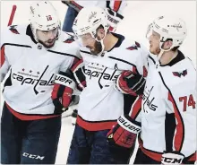  ?? TAMPA BAY TIMES FILE PHOTO ?? Washington Capitals defenceman Brooks Orpik, centre, gets helped off the ice by centre Chandler Stephenson and defenceman John Carlson (74) after getting checked by Tampa Bay Lightning centre Cedric Paquette in Game 7 of the Eastern Conference final.