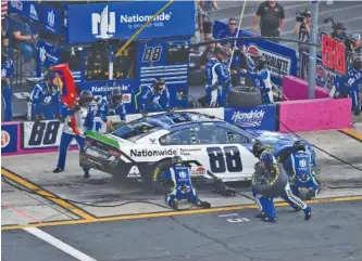  ?? AP PHOTO/MIKE MCCARN ?? Alex Bowman makes a pit stop after damaging his tires on the first lap of last Sunday’s NASCAR Cup Series race at Charlotte Motor Speedway. Today’s race is at Dover Internatio­nal Speedway in Delaware.