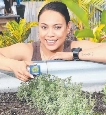  ?? Picture: JUSTIN BRIERTY ?? THYME ON HER SIDE: Lesley Koka, from the Bungalow Hotel, with thyme at the hotel’s herb garden, which has been used to garnish dishes since 2016.