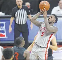  ?? Heidi Fang Las Vegas Review-journal @Heidifang ?? David Jenkins gets off a shot against San Diego State in Wednesday’s game. Jenkins had 32 points on 11 of 23 shooting in the Rebels’ loss, which likely locks them in as the seventh seed.