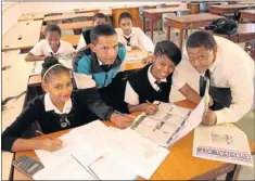  ?? Picture: EUGENE
COETZEE ?? HARD AT WORK: Among the Chatty High School pupils benefiting from the Matric Survival Guide, published in The Herald, are, front from left, Brandy Lottering, Jabesco Vyuers, Sharonise Draghoende­r and Justin Afrika; and, back from left, Beneil Booysen,...