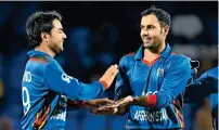  ?? AFP ?? Spinner Rashid Khan (left) and Mohammad Nabi will shoulder Afghanista­n’s challenge in the ICC World Cup. —