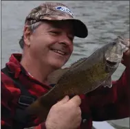  ?? (Arkansas Democrat-Gazette/Bryan Hendricks) ?? Smallmouth bass will bite stickbaits on the Buffalo River in autumn. Mornings are often cold enough to require warm clothing.