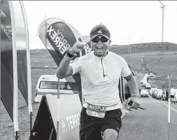  ?? PROVIDED TO CHINA DAILY ?? A runner keeps his spirits up during Saturday’s 180-kilometer BMW Hood to Coast China Relay in Hebei province.